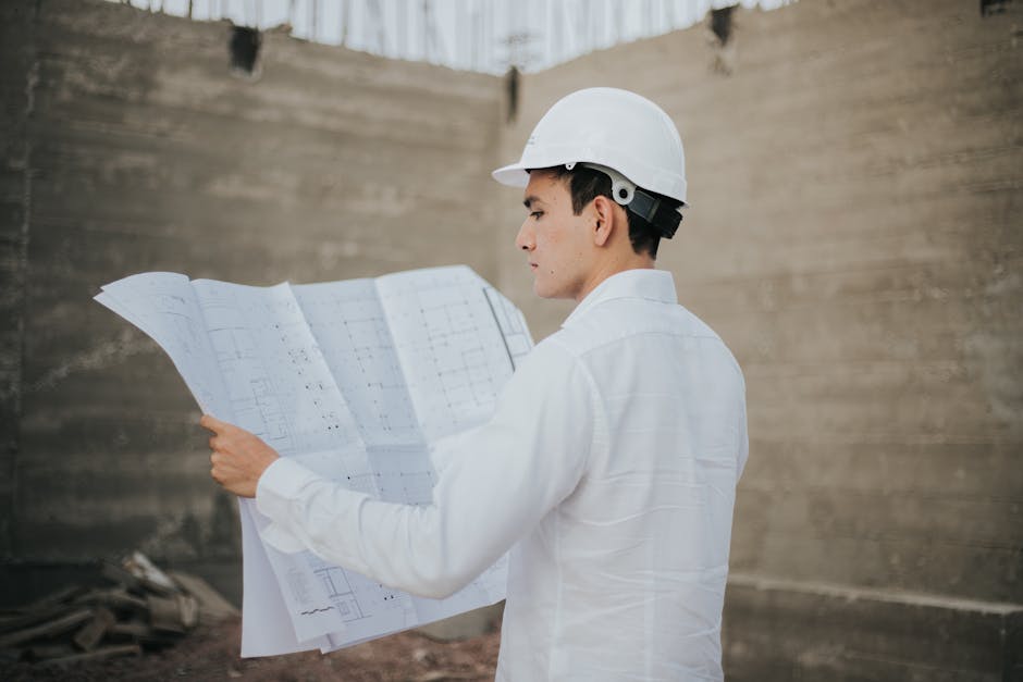 Contractor reviewing blueprints for a custom kitchen remodel